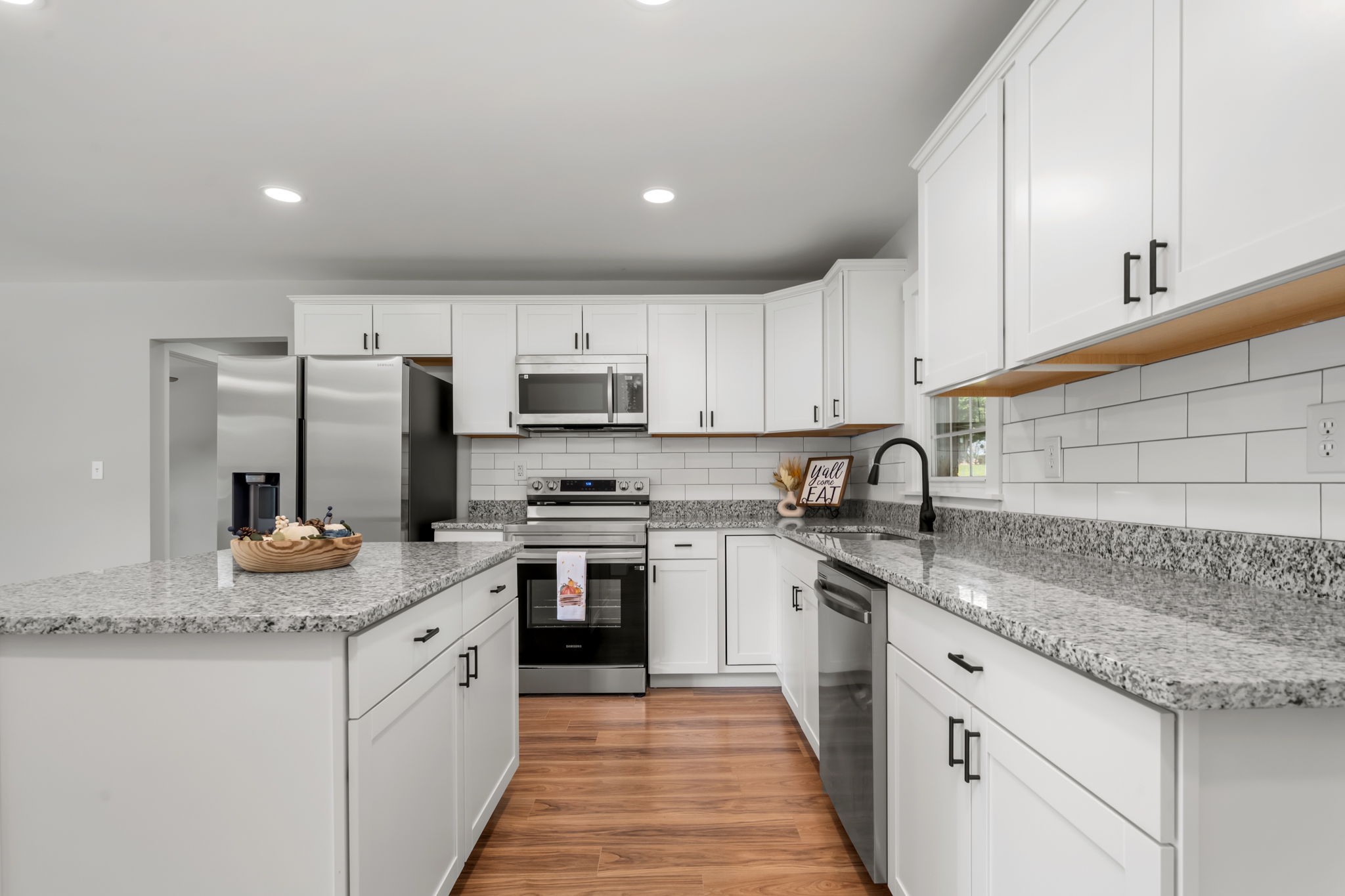 210 Rigney Drive Manchester, TN 37355 - Photo 15 of 39 a kitchen with stainless steel appliances granite countertop a sink stove cabinets and refrigerator