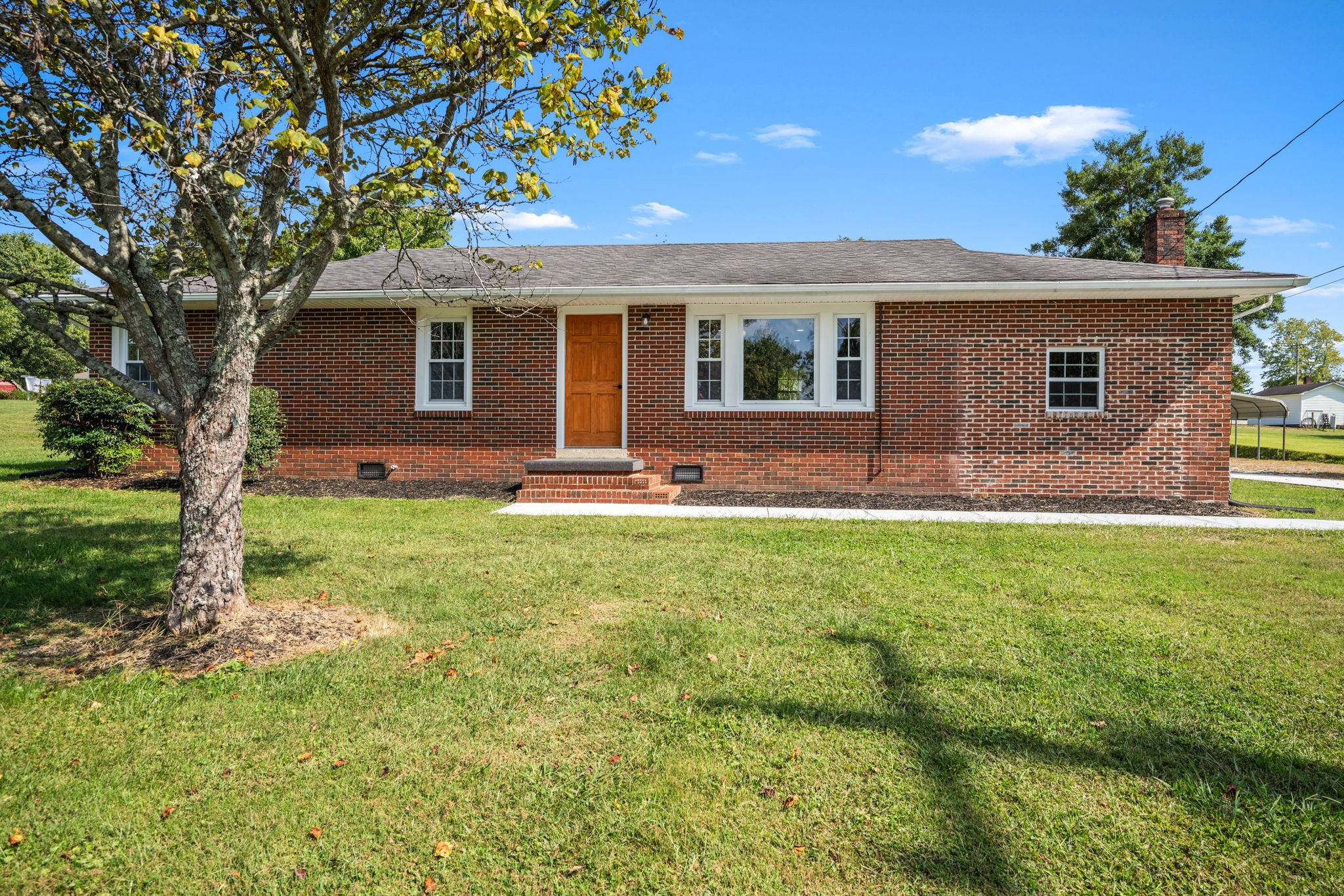 210 Rigney Drive Manchester, TN 37355 - Photo 2 of 39 a front view of house with yard and outdoor seating