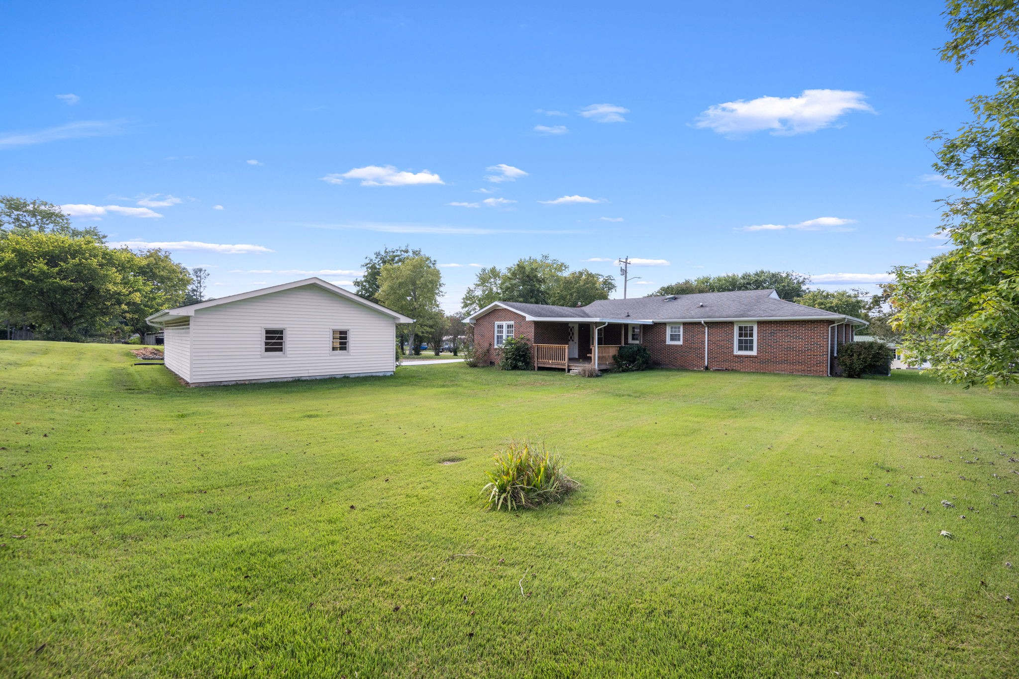 210 Rigney Drive Manchester, TN 37355 - Photo 38 of 39 a front view of a house with a garden and yard