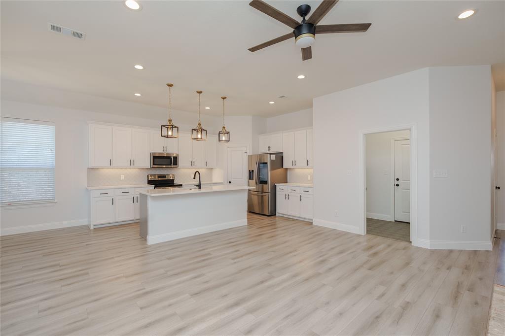 520 Mustang Lane Pilot Point, TX 76258 - Photo 13 of 15 a view of kitchen with wooden floor