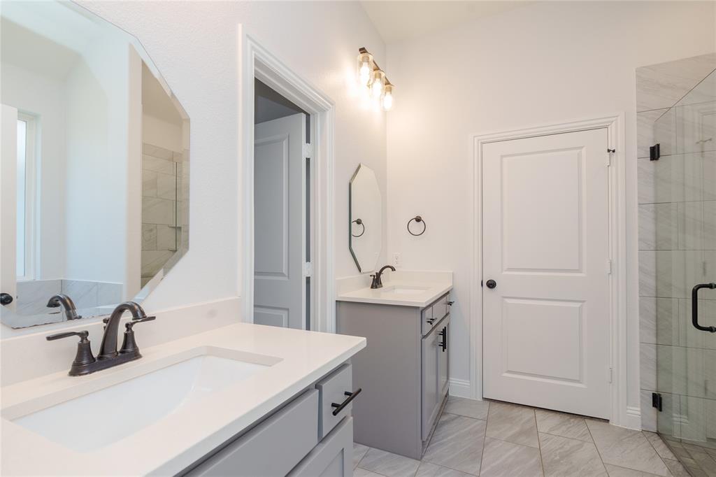 520 Mustang Lane Pilot Point, TX 76258 - Photo 9 of 15 a bathroom with a sink and a mirror