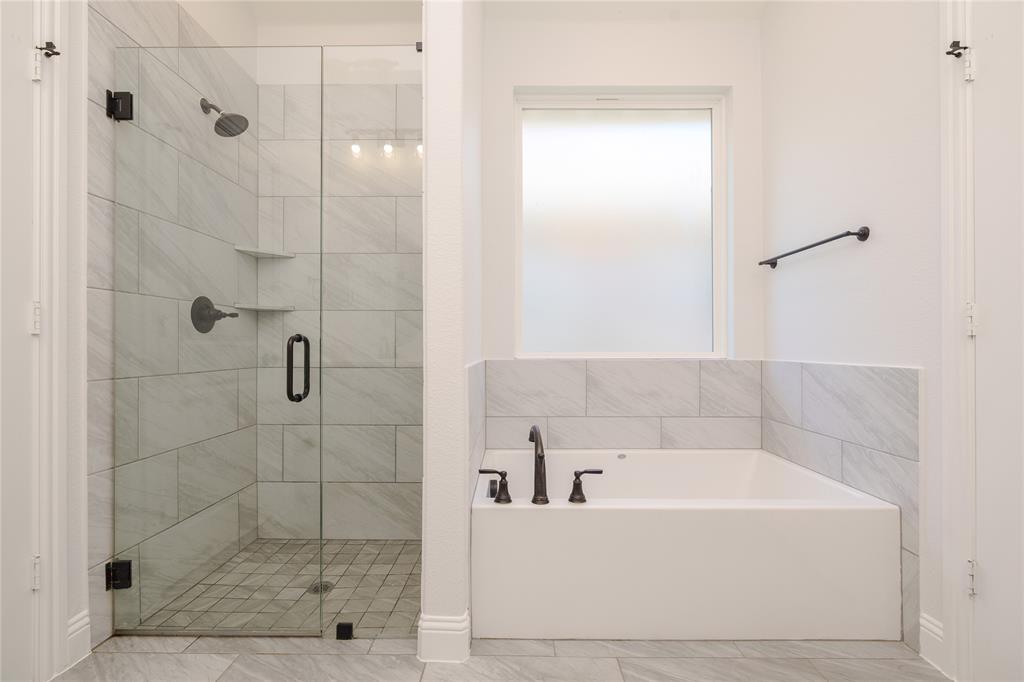 520 Mustang Lane Pilot Point, TX 76258 - Photo 10 of 15 a bathroom with a bathtub and shower
