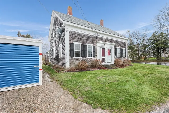 a view of backyard with a garden and plants