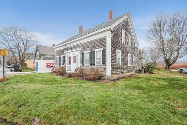 a front view of building with yard