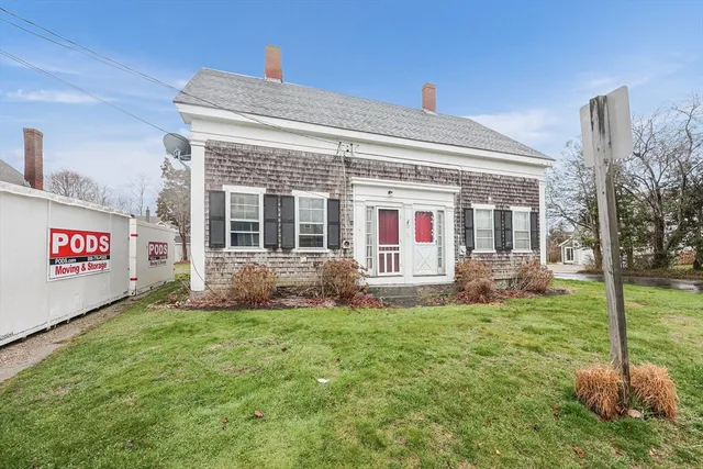 a view of house with yard