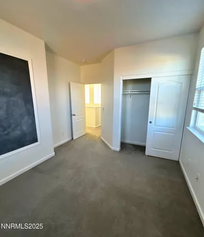 a view of a room with closet and garage