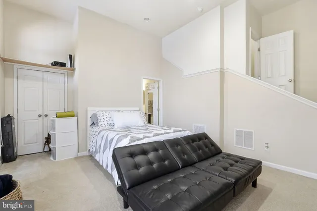 a bedroom with a bed and a cabinets