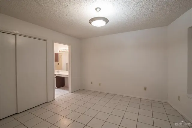 a kitchen with kitchen island a sink appliances cabinets and a counter top space