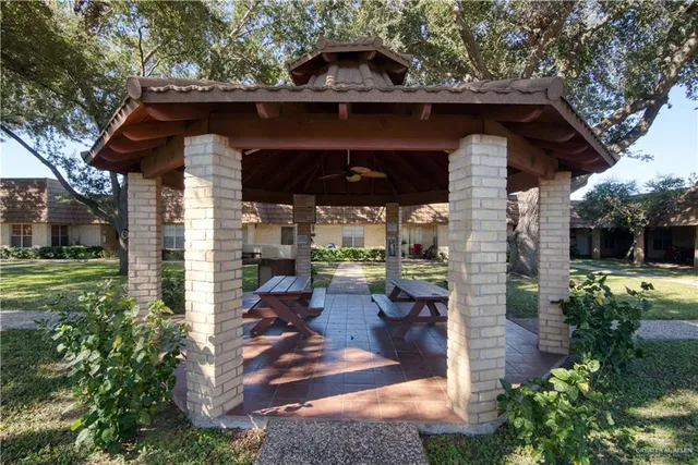 a view of a wooden house with a yard
