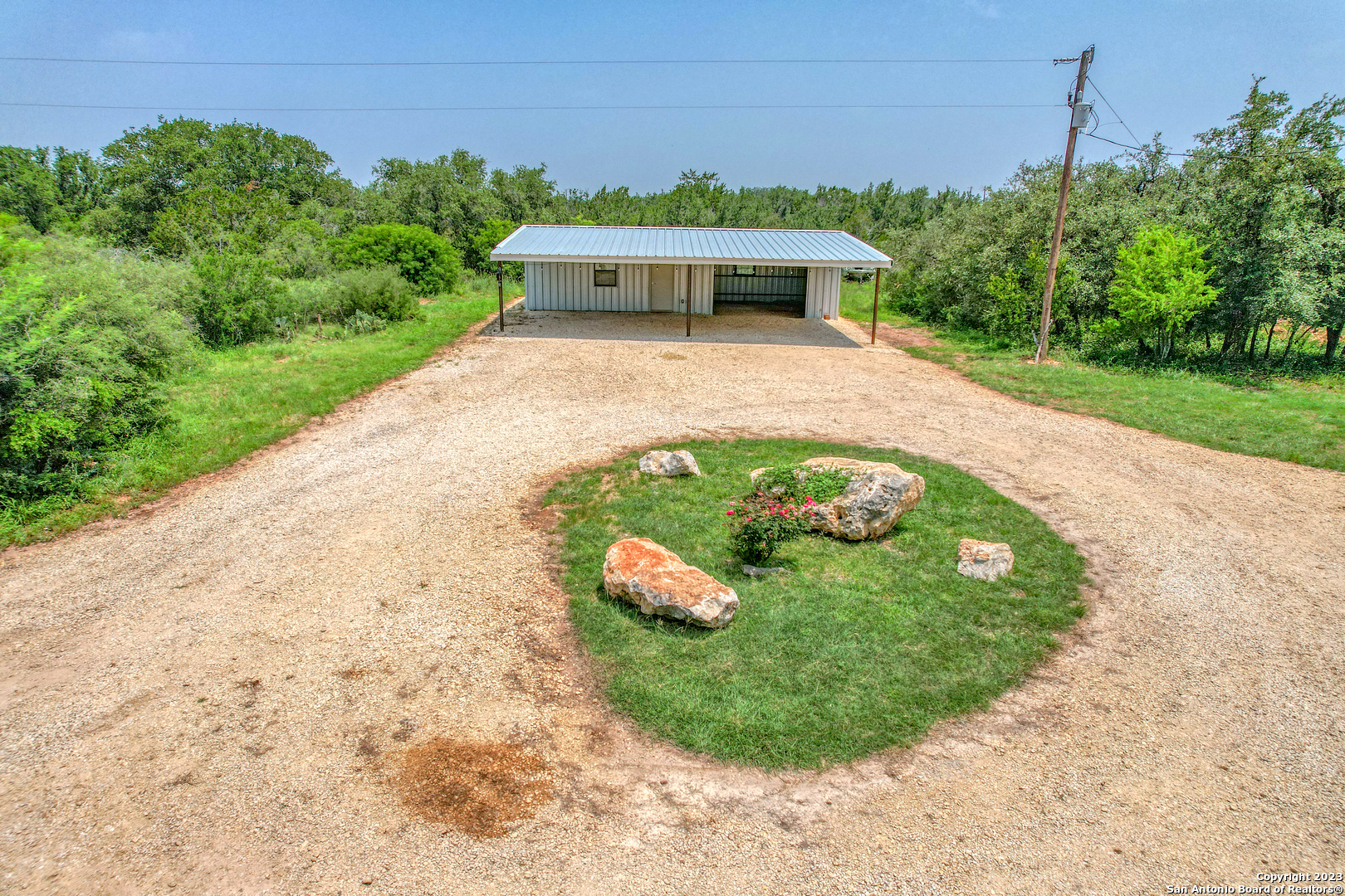 a view of a swimming pool with a yard