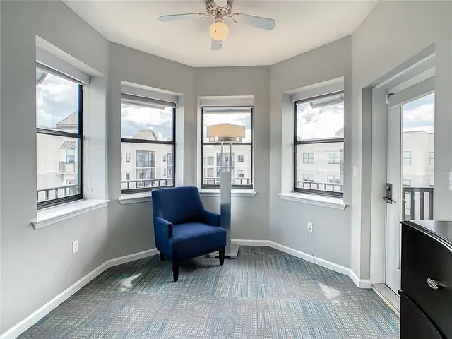 a living room with furniture and a window