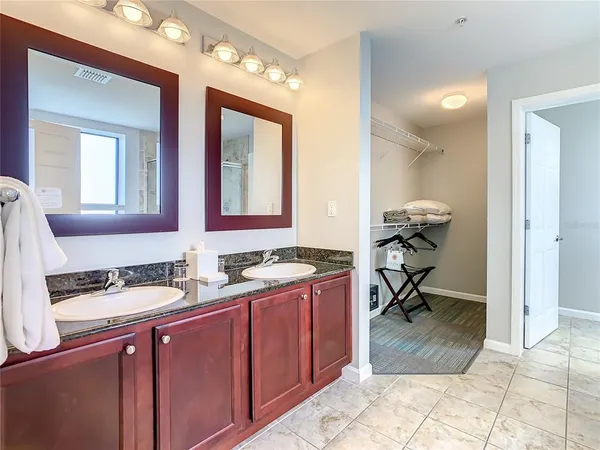 a bathroom with a sink double vanity and a mirror