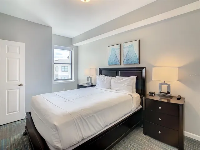 a bedroom with a bed and window