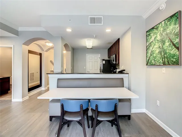 a view of a dining room with furniture window and wooden floor