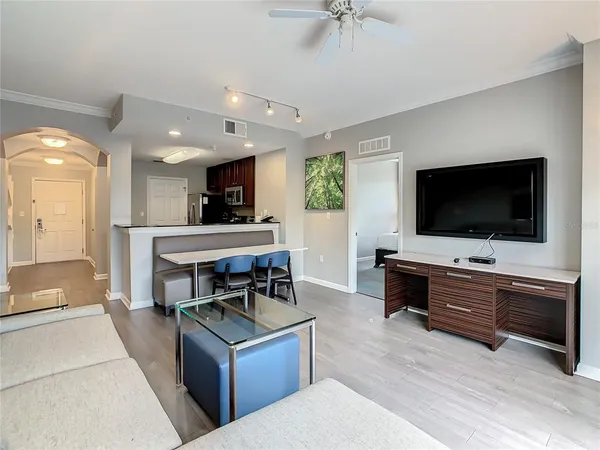 a living room with furniture and a flat screen tv