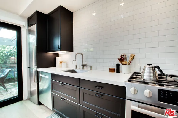 a kitchen with a cabinets and a stove
