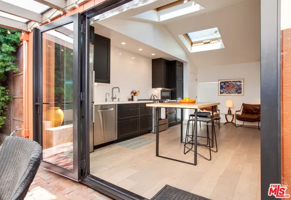 a view of a patio with chairs and tables