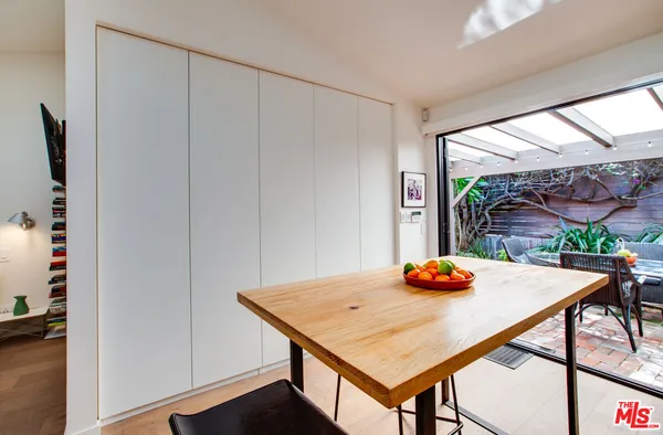 a view of a dining table and chairs in the room