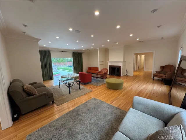 a living room with furniture fireplace and window