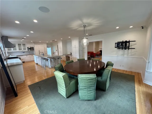 a living room with furniture and a view of kitchen
