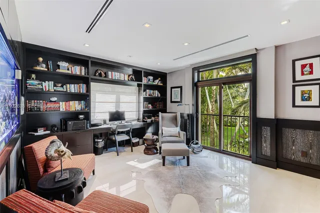 a bedroom with a bed couch and window