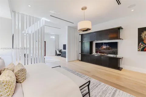 a bedroom with a bed furniture and a window