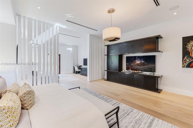 a bedroom with a bed furniture and a window