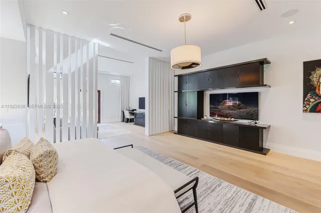 a bedroom with a bed furniture and a window