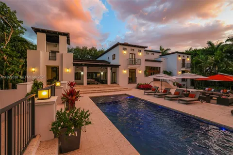 a view of a backyard with furniture and a patio