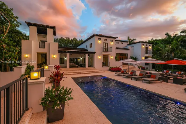 a view of a backyard with furniture and a patio