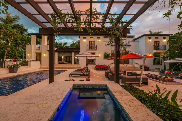 a view of a park with plants and palm trees