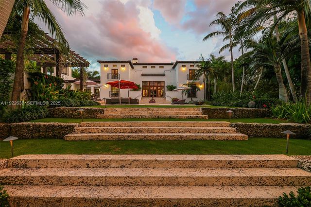 a view of a lake with a large trees