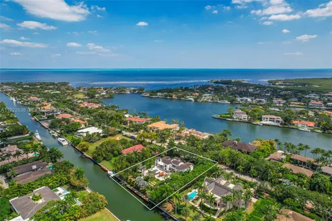 an aerial view of a houses with outdoor space swimming pool and outdoor seating