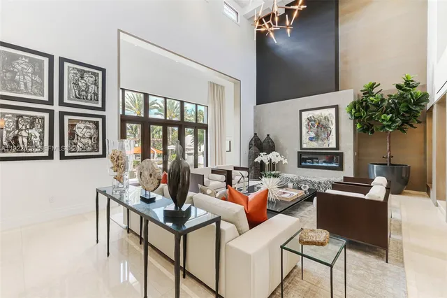a kitchen with white cabinets and sink
