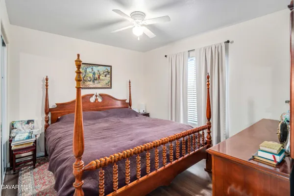 a bedroom with furniture and a window