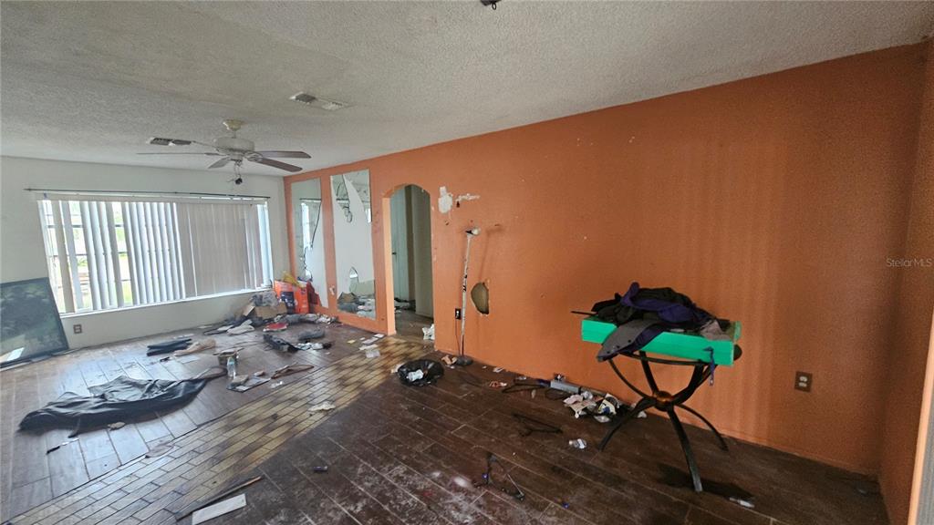 8428 Paxton Drive Port Richey, FL 34668 - Photo 13 of 100 a living room with furniture and a window