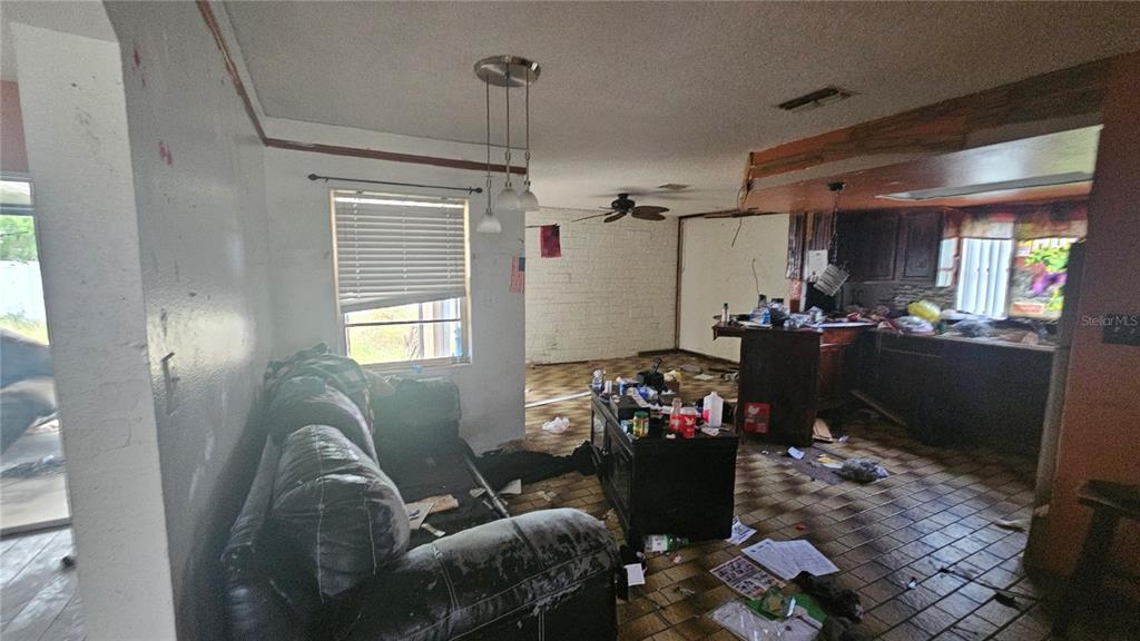 8428 Paxton Drive Port Richey, FL 34668 - Photo 14 of 100 a living room with furniture and a window