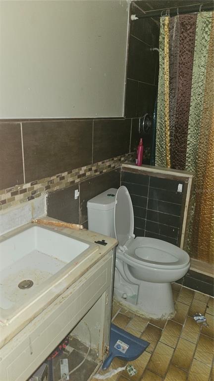 8428 Paxton Drive Port Richey, FL 34668 - Photo 28 of 100 a bathroom with a sink and a toilet