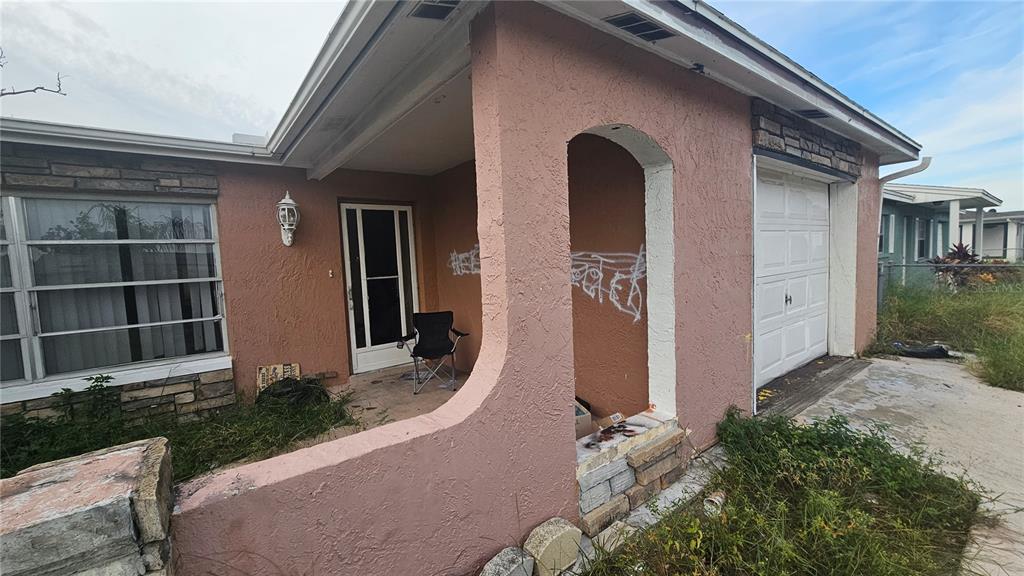 8428 Paxton Drive Port Richey, FL 34668 - Photo 5 of 100 a front view of a house with a yard