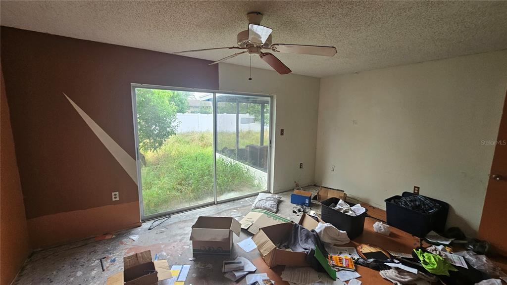 8428 Paxton Drive Port Richey, FL 34668 - Photo 64 of 100 a living room with furniture and a window