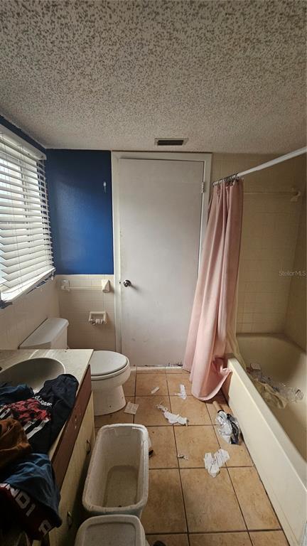 8428 Paxton Drive Port Richey, FL 34668 - Photo 65 of 100 a bathroom with a sink toilet and shower