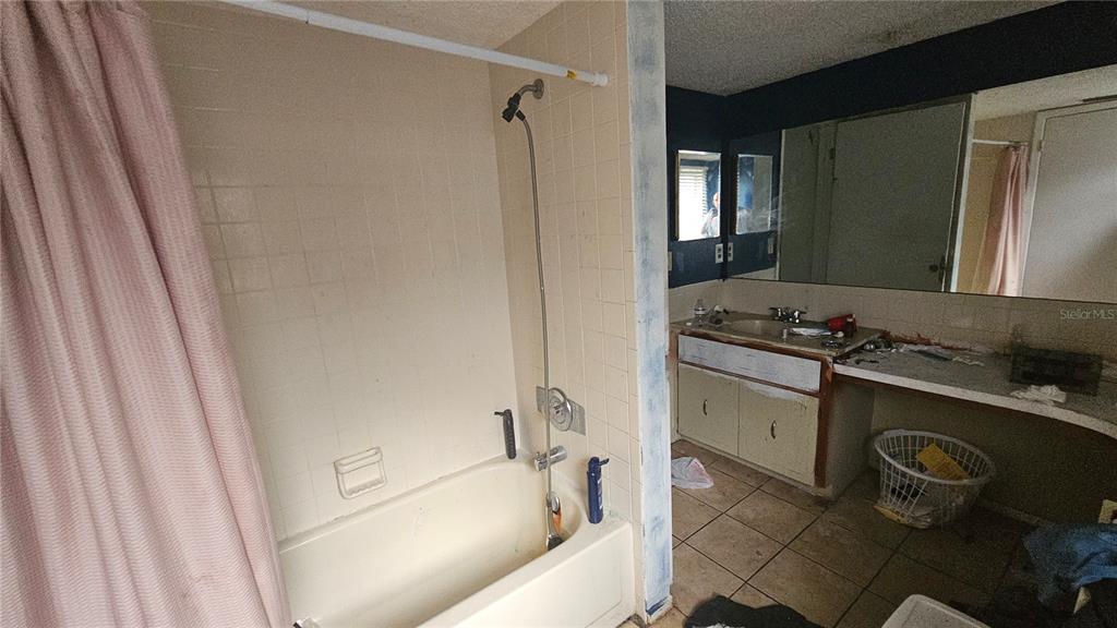 8428 Paxton Drive Port Richey, FL 34668 - Photo 70 of 100 a bathroom with a granite countertop sink toilet and shower