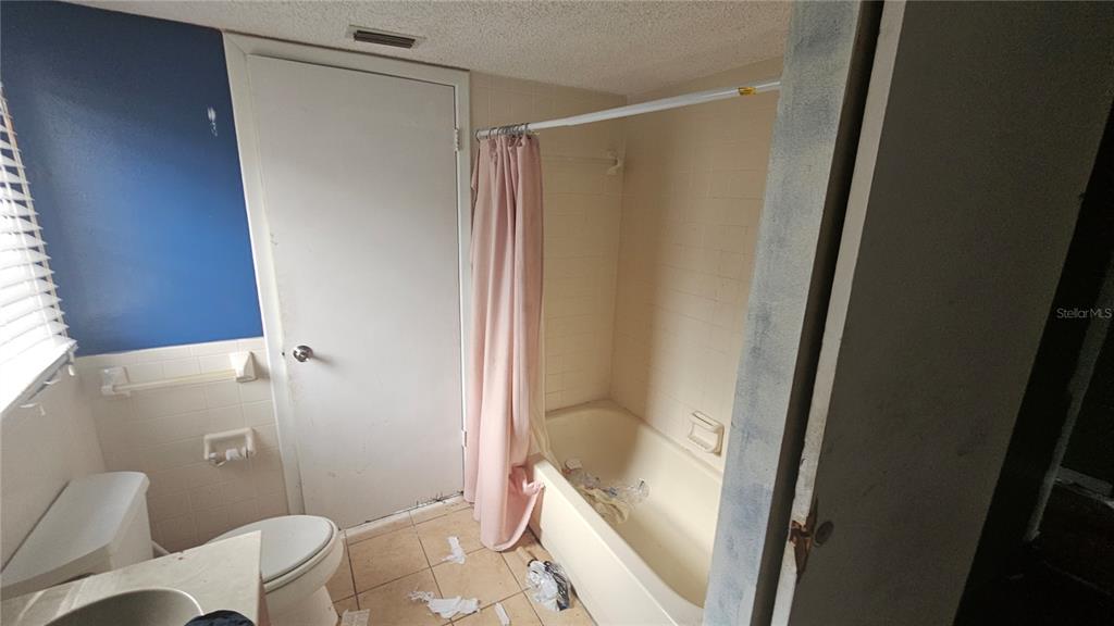 8428 Paxton Drive Port Richey, FL 34668 - Photo 72 of 100 a bathroom with a shower and a toilet