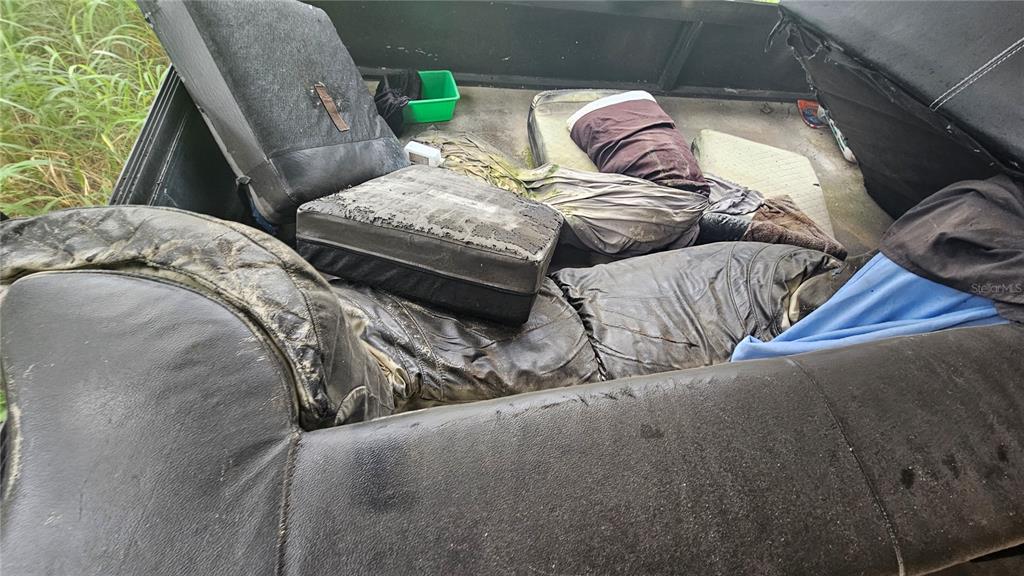 8428 Paxton Drive Port Richey, FL 34668 - Photo 90 of 100 a bedroom with a bed and a window