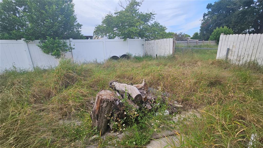 8428 Paxton Drive Port Richey, FL 34668 - Photo 91 of 100 a view of a wooden fence and a yard