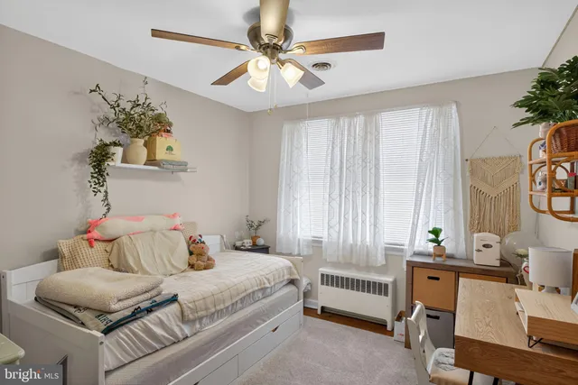 a bedroom with a bed and a couch