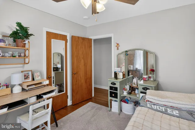 a living room with furniture a piano and a window