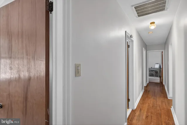 a view of a bathroom from the hallway