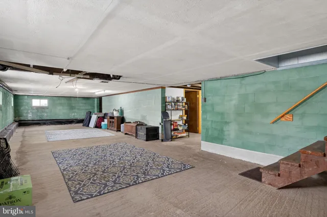 a view of a livingroom with furniture and window