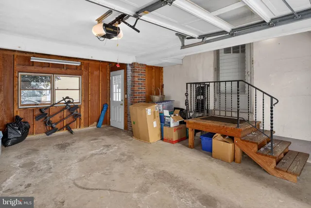a view of a livingroom with furniture hardwood floor and windows